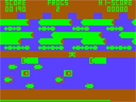 In game image of Frogger on the Acorn Atom.