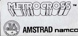 Top of cartridge artwork for Metro-Cross on the Amstrad CPC.