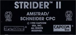 Top of cartridge artwork for Strider 2 on the Amstrad CPC.