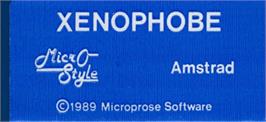 Top of cartridge artwork for Xenophobe on the Amstrad CPC.
