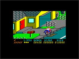 In game image of Paperboy on the Amstrad CPC.