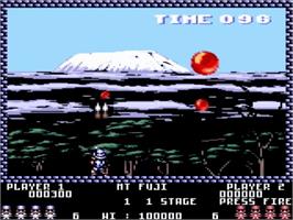 In game image of Pang on the Amstrad GX4000.
