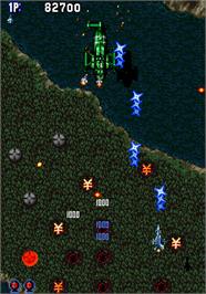 In game image of Aero Fighters on the Arcade.