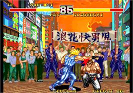 In game image of Karnov's Revenge / Fighter's History Dynamite on the Arcade.