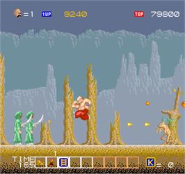 In game image of Karnov on the Arcade.