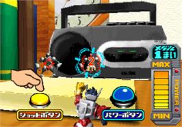 In game image of Microman Battle Charge on the Arcade.