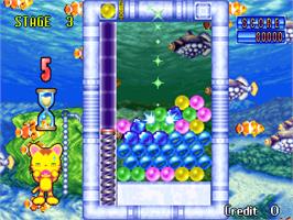 In game image of Puzzle Uo Poko on the Arcade.