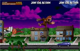 In game image of Rampage: World Tour on the Arcade.