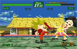 In game image of Virtua Fighter Kids on the Arcade.