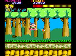 In game image of Wonder Boy on the Arcade.