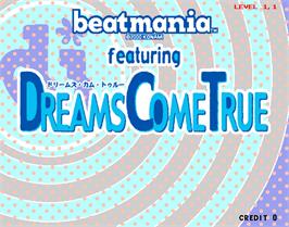 Title screen of beatmania featuring Dreams Come True on the Arcade.
