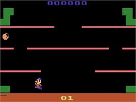 In game image of Mario Bros. on the Atari 2600.