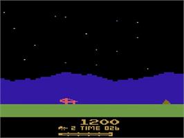In game image of Moon Patrol on the Atari 2600.
