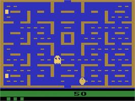 In game image of Pac-Man on the Atari 2600.