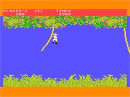 In game image of Jungle Hunt on the Atari 8-bit.