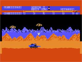 In game image of Moon Patrol on the Atari 8-bit.