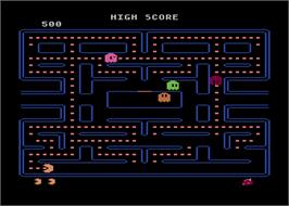 In game image of Pac-Man on the Atari 8-bit.