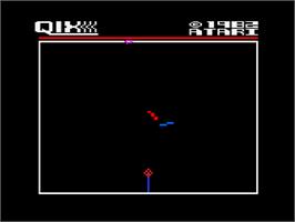 In game image of Qix on the Atari 8-bit.