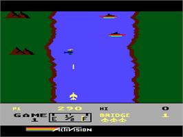 In game image of River Raid on the Atari 8-bit.