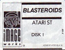 Top of cartridge artwork for Blasteroids on the Atari ST.