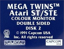 Top of cartridge artwork for Mega Twins on the Atari ST.