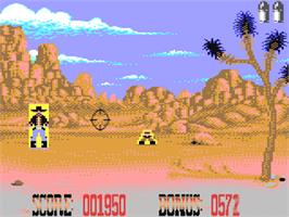In game image of Buffalo Bill's Wild West Show on the Commodore 64.