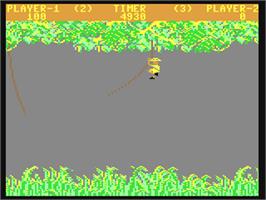 In game image of Jungle Hunt on the Commodore 64.
