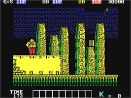 In game image of Karnov on the Commodore 64.