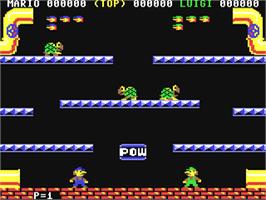 In game image of Mario Bros. on the Commodore 64.