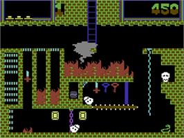 In game image of Montezuma's Revenge on the Commodore 64.