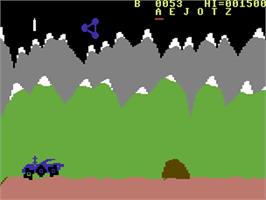 In game image of Moon Patrol on the Commodore 64.