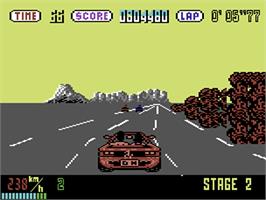 In game image of OutRun on the Commodore 64.