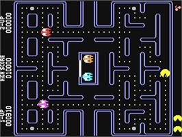 In game image of Pac-Man on the Commodore 64.
