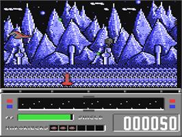 In game image of Revenge of Defender on the Commodore 64.