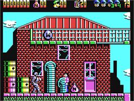In game image of RoboCop 2 on the Commodore 64.