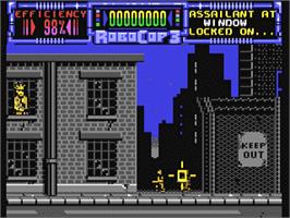 In game image of RoboCop 3 on the Commodore 64.