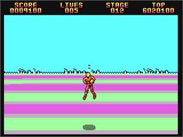 In game image of Space Harrier II on the Commodore 64.