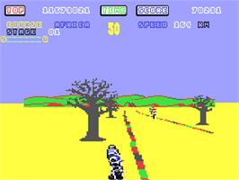 In game image of Super Hang-On on the Commodore 64.