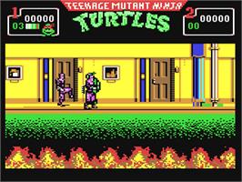 In game image of Teenage Mutant Ninja Turtles II: The Arcade Game on the Commodore 64.