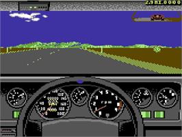 In game image of Test Drive II Car Disk: The Supercars on the Commodore 64.