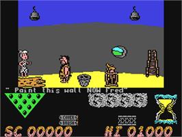 In game image of The Flintstones on the Commodore 64.