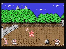 In game image of Tiger Road on the Commodore 64.
