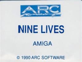Top of cartridge artwork for 9 Lives on the Commodore Amiga.