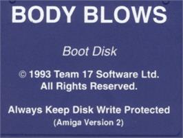 Top of cartridge artwork for Body Blows on the Commodore Amiga.