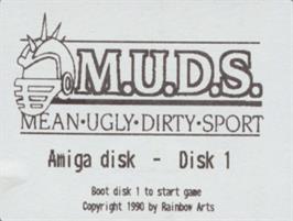 Top of cartridge artwork for M.U.D.S. - Mean Ugly Dirty Sport on the Commodore Amiga.