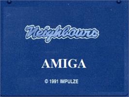 Top of cartridge artwork for Neighbours on the Commodore Amiga.
