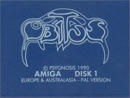 Top of cartridge artwork for Obitus on the Commodore Amiga.