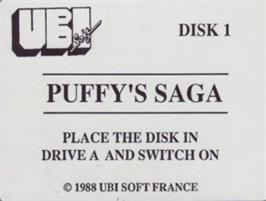 Top of cartridge artwork for Puffy's Saga on the Commodore Amiga.