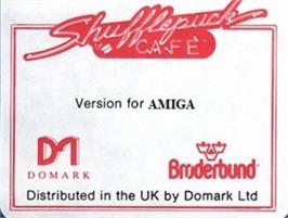 Top of cartridge artwork for Shufflepuck Cafe on the Commodore Amiga.
