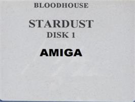 Top of cartridge artwork for Star Dust on the Commodore Amiga.
